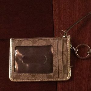 Coach Wristlet measures 3.3 x 4.5